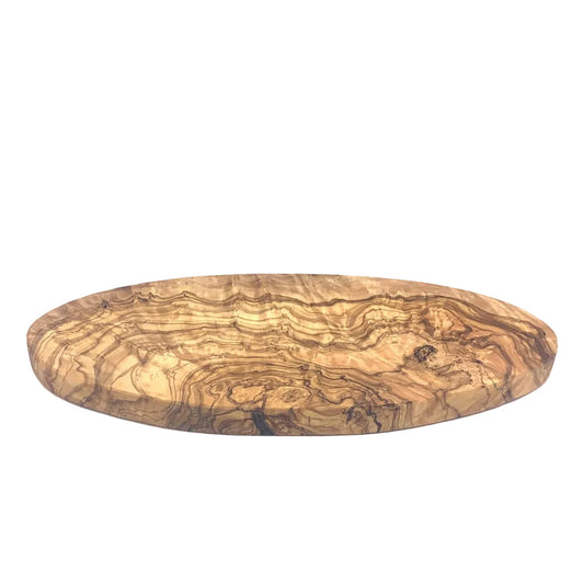 An oval wooden serving board with a prominent wavy olive wood grain pattern in shades of brown and tan, photographed on a white studio background.