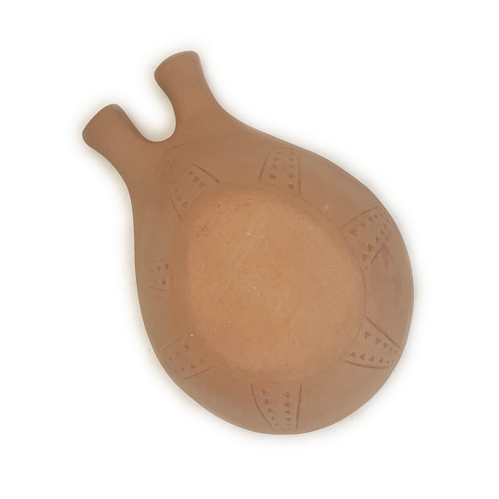 The base of a Handmade Terracotta & White Rustic Greek Theodore Serving Bowl