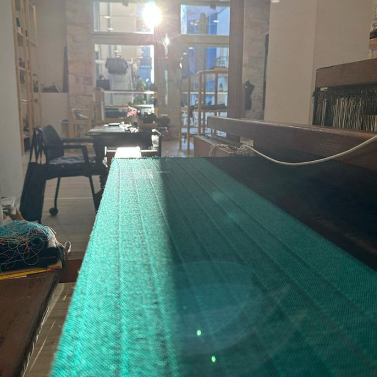 Weaving a turquoise scarf