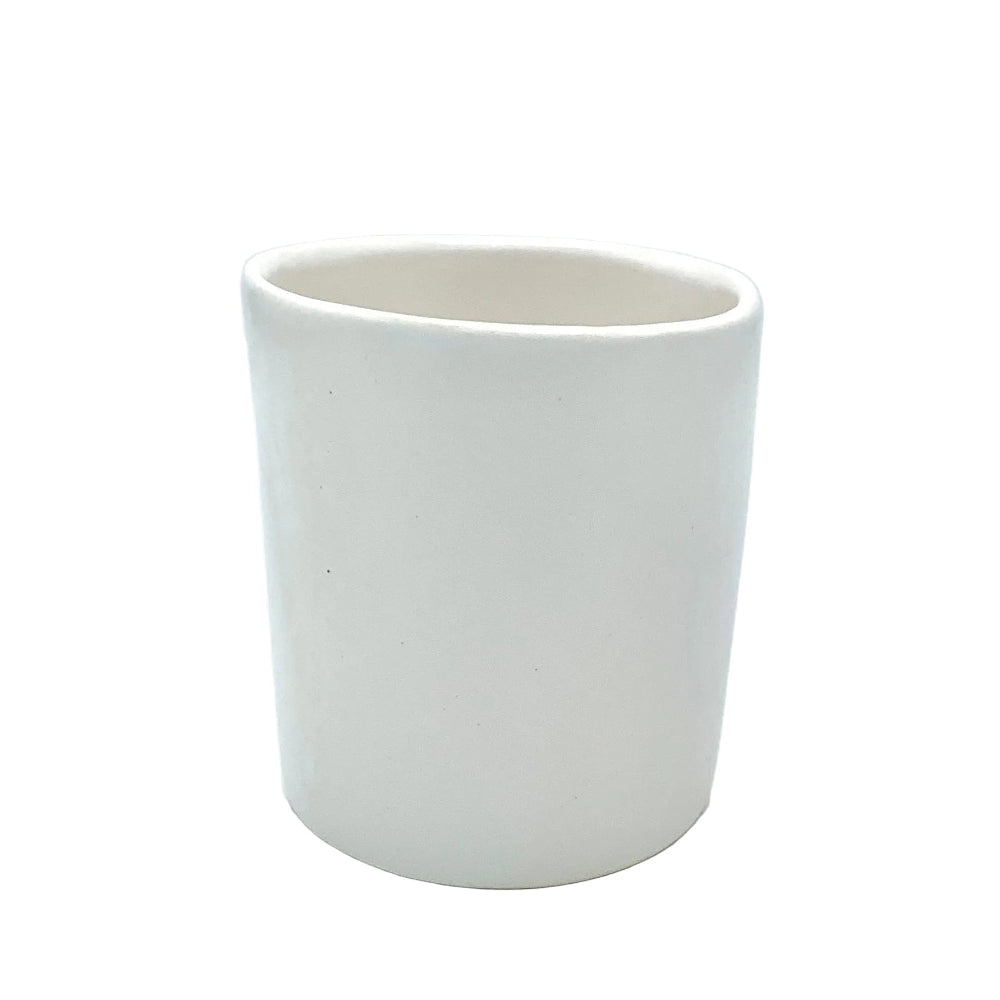 white ceramic tumbler