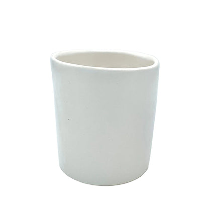 white ceramic tumbler