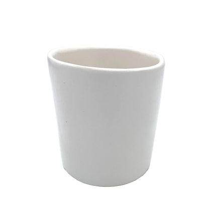 white ceramic tumbler
