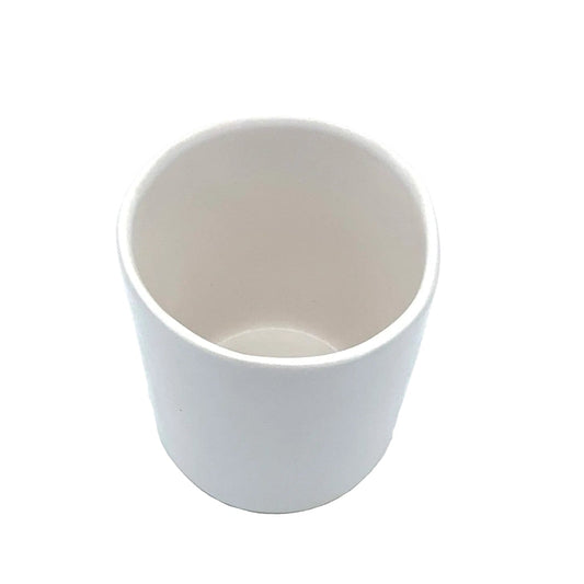 white ceramic tumbler