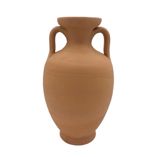 A classic terracotta clay vase with two loop handles, standing upright on a white surface against a white background.