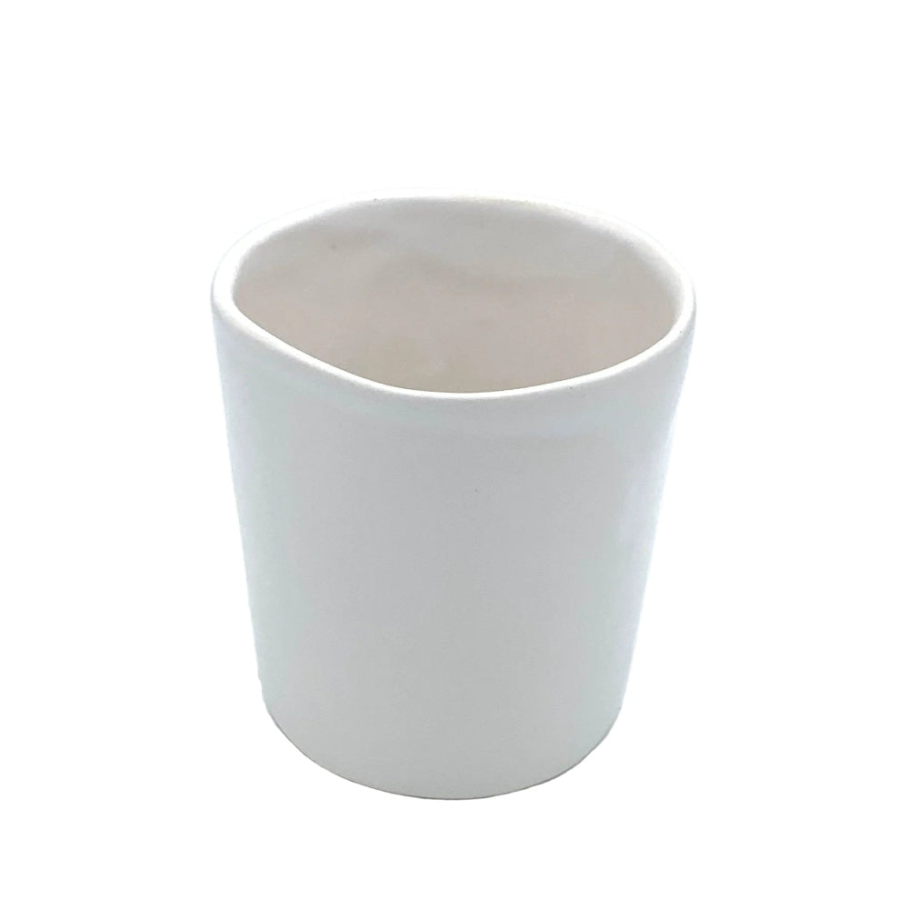 white ceramic tumbler