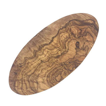 An oval wooden board with a highly figured, wavy grain pattern in shades of brown and tan, photographed on a plain white background.