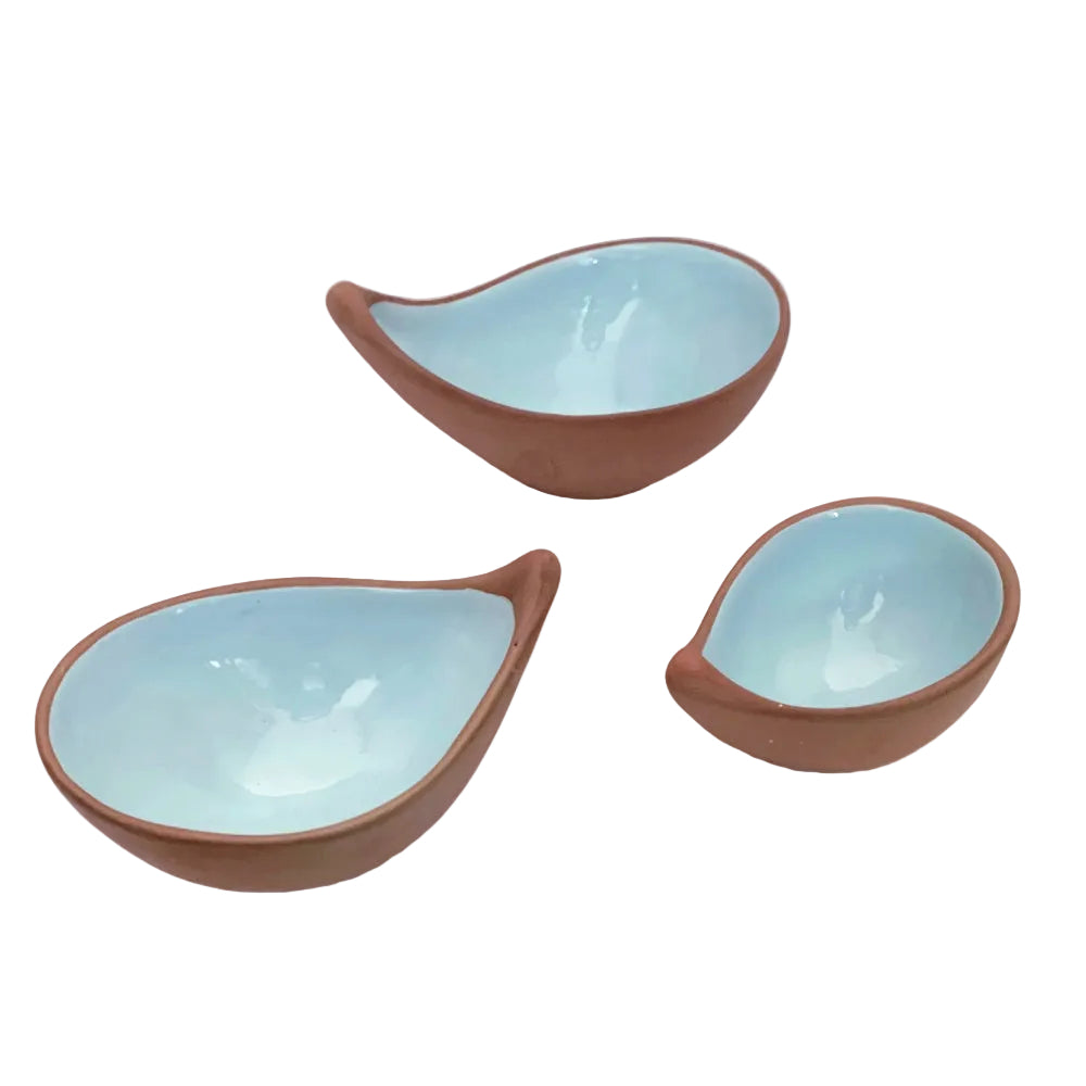 3 terracotta bowls with a blue glaze interior