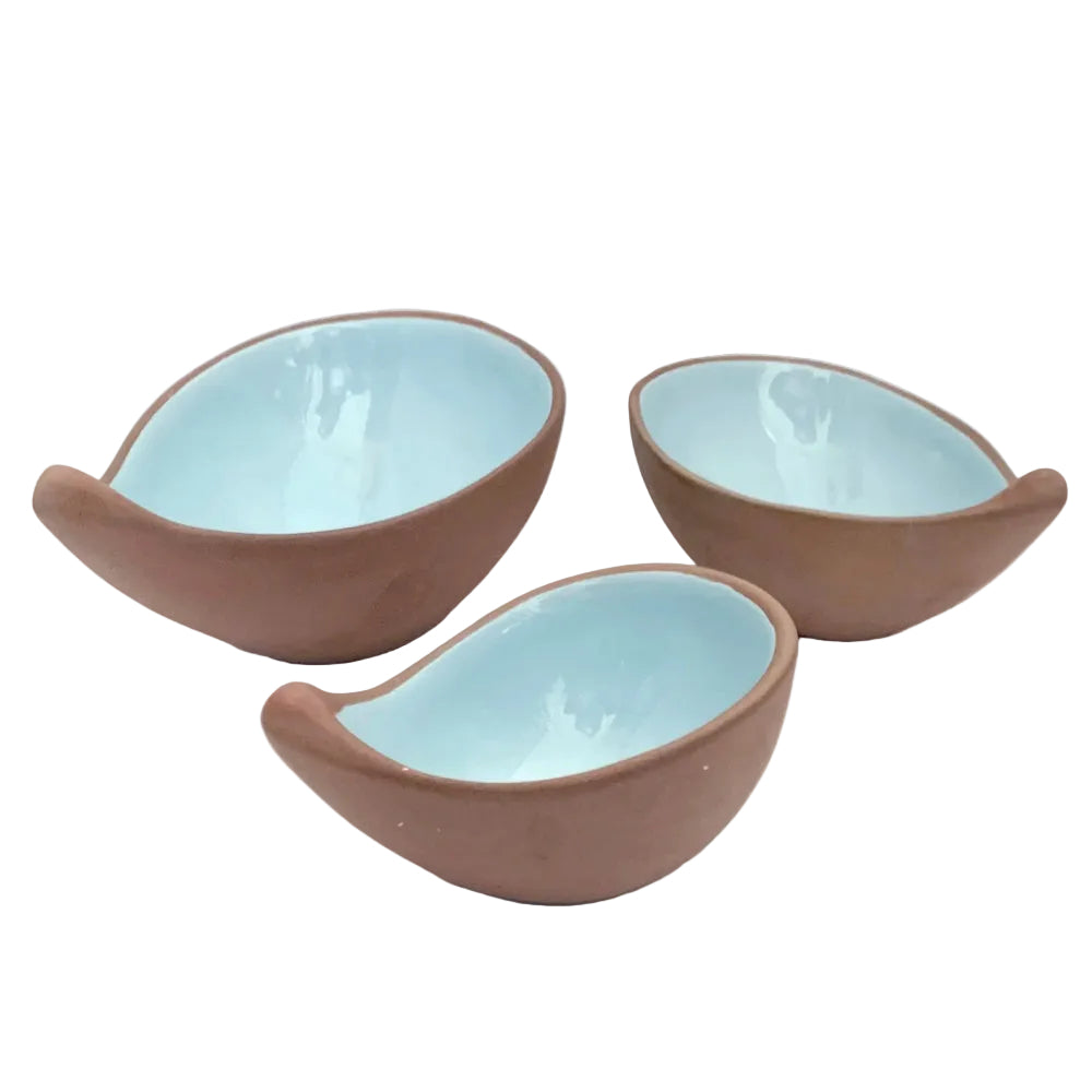 3 terracotta bowls with a blue glaze interior